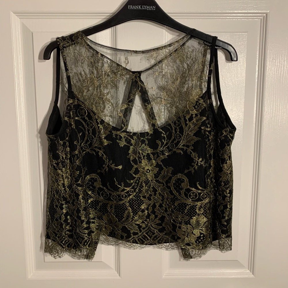 Lacy top….black and gold…..very good condition